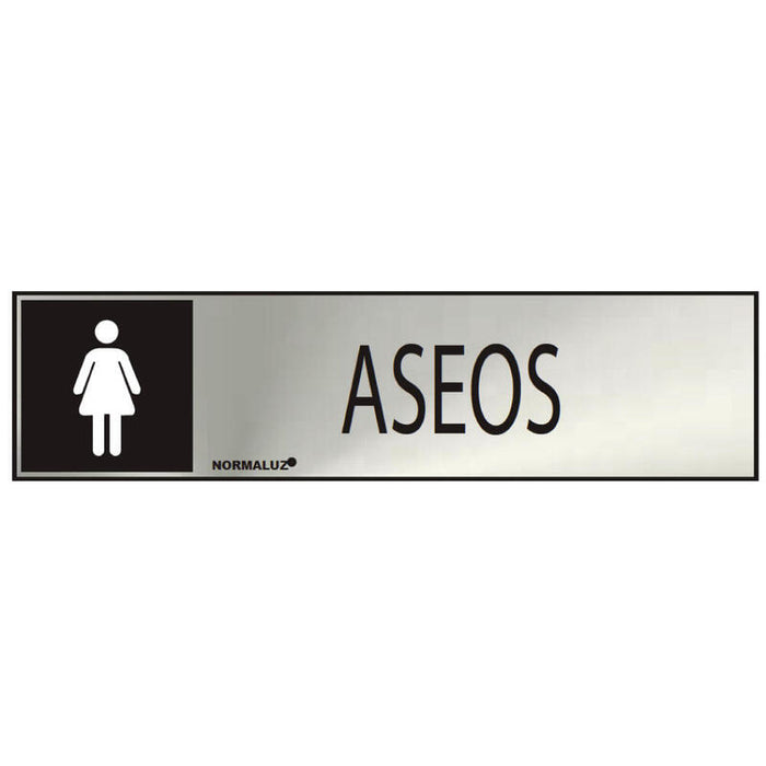 Cartel Informativo "Aseos" Mujer (Inox Adhesivo 0.8mm) 5x20cm Normaluz